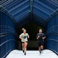 A couple runs together through little mac bridge